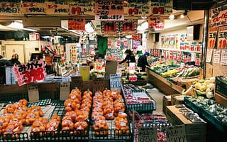 open market stall with veggies and fruits wrapped in plastic